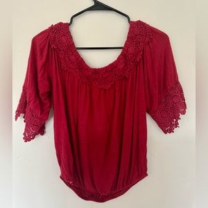 Red shirt/blouse. Minor holes on R sleeve